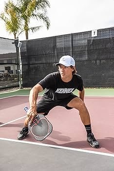 man playing pickleball with prokennex black ace paddle